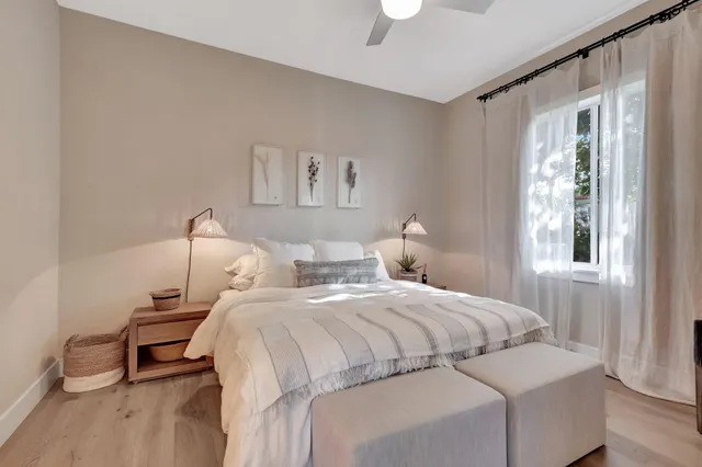 a bathroom with double sink and a mirror