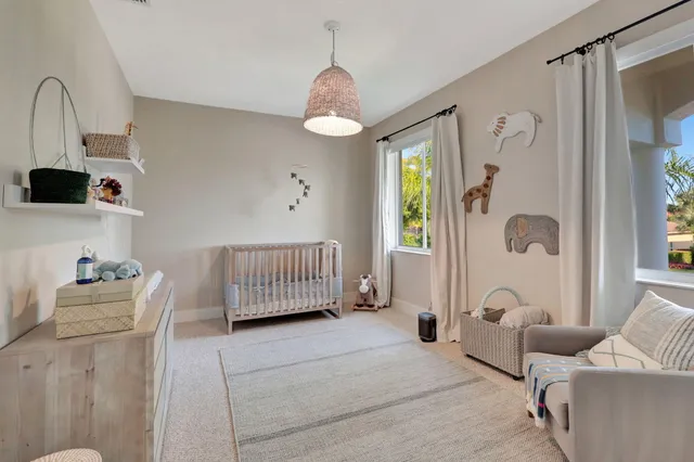 a view of livingroom with furniture and floor to ceiling window