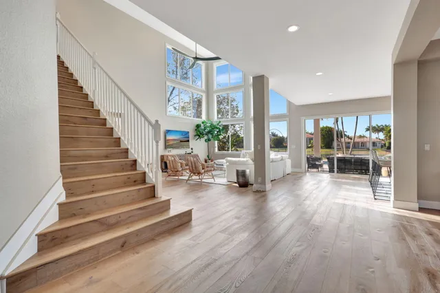 a view of an entryway with wooden floor and windows