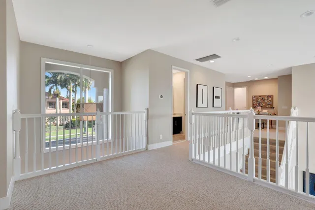 a patio with yard glass top table and chairs