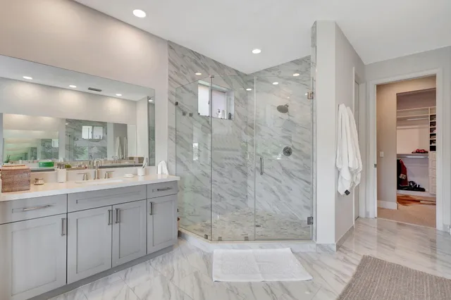 a view of a house with a backyard and a patio