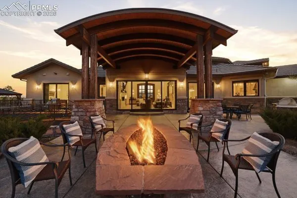 a view of a chairs and table in the patio