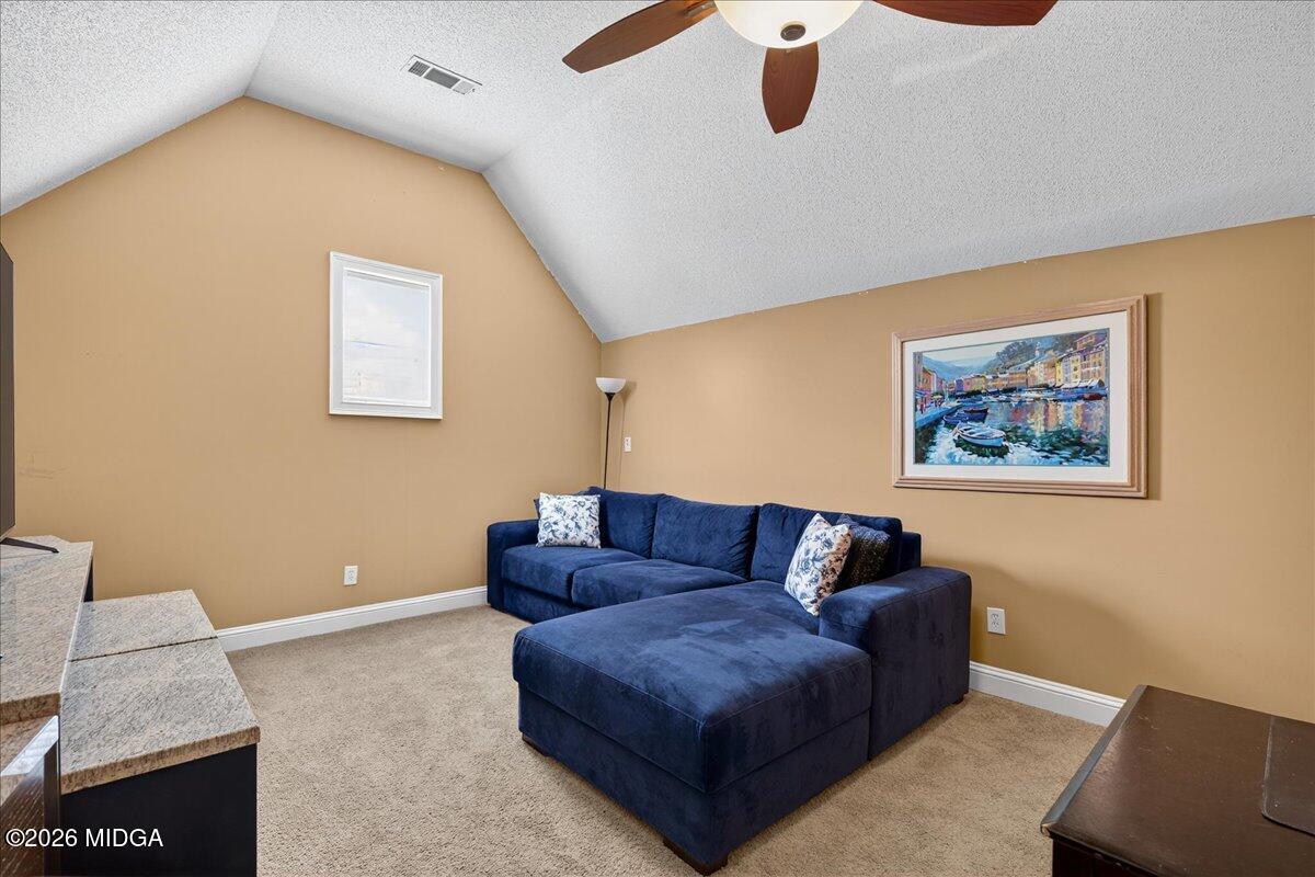 518 River Overlook Forsyth, GA 31029 - Photo 37 of 96 a living room with furniture and a rug
