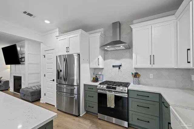 a view of a hallway with a white walls and wooden floor