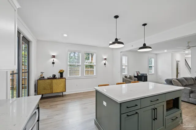 a view of a hallway with a livingroom and a hallway