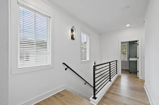 a bedroom with a bed tv and window