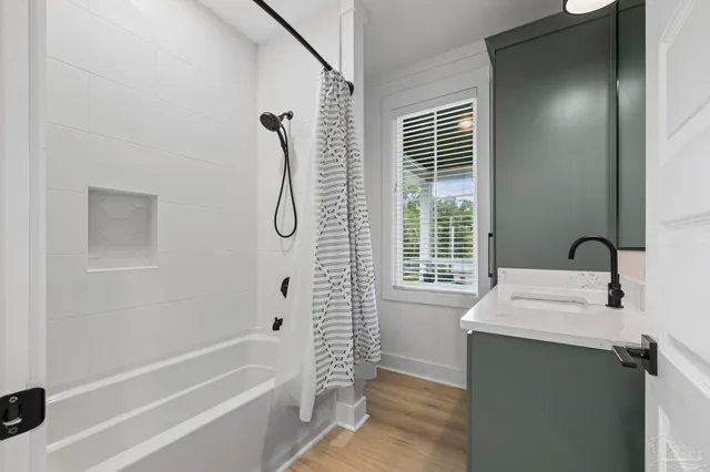 a en suite bathroom with a shower and a sink