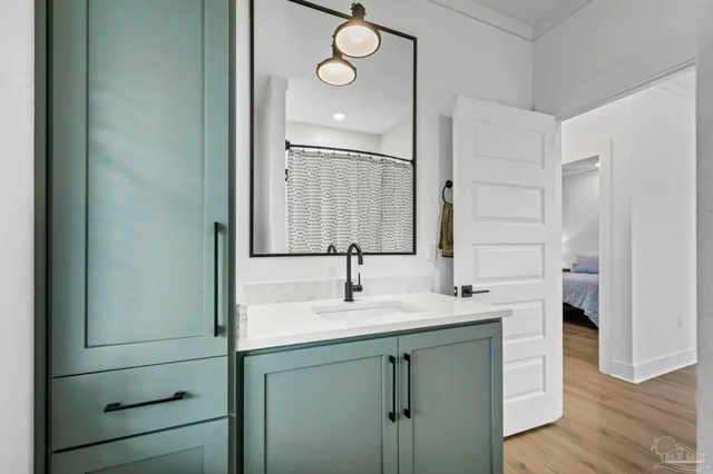 a bathroom with a double vanity sink double mirror and bathtub