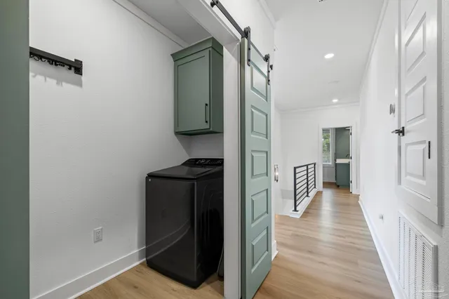 a view of a room with wooden floor and outdoor seating