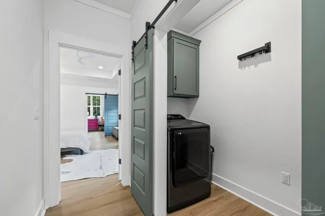 a view of porch with a table and chairs and floor to ceiling window