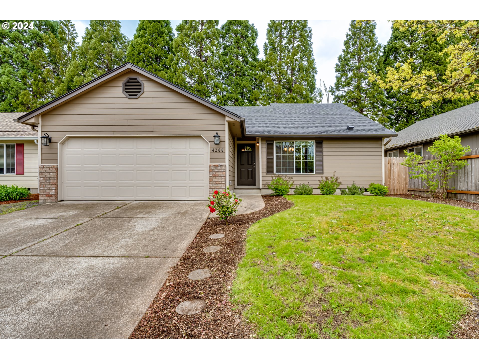4288 Cole Way Springfield, OR 97478 - Photo 1 of 21 a front view of house with yard and green space