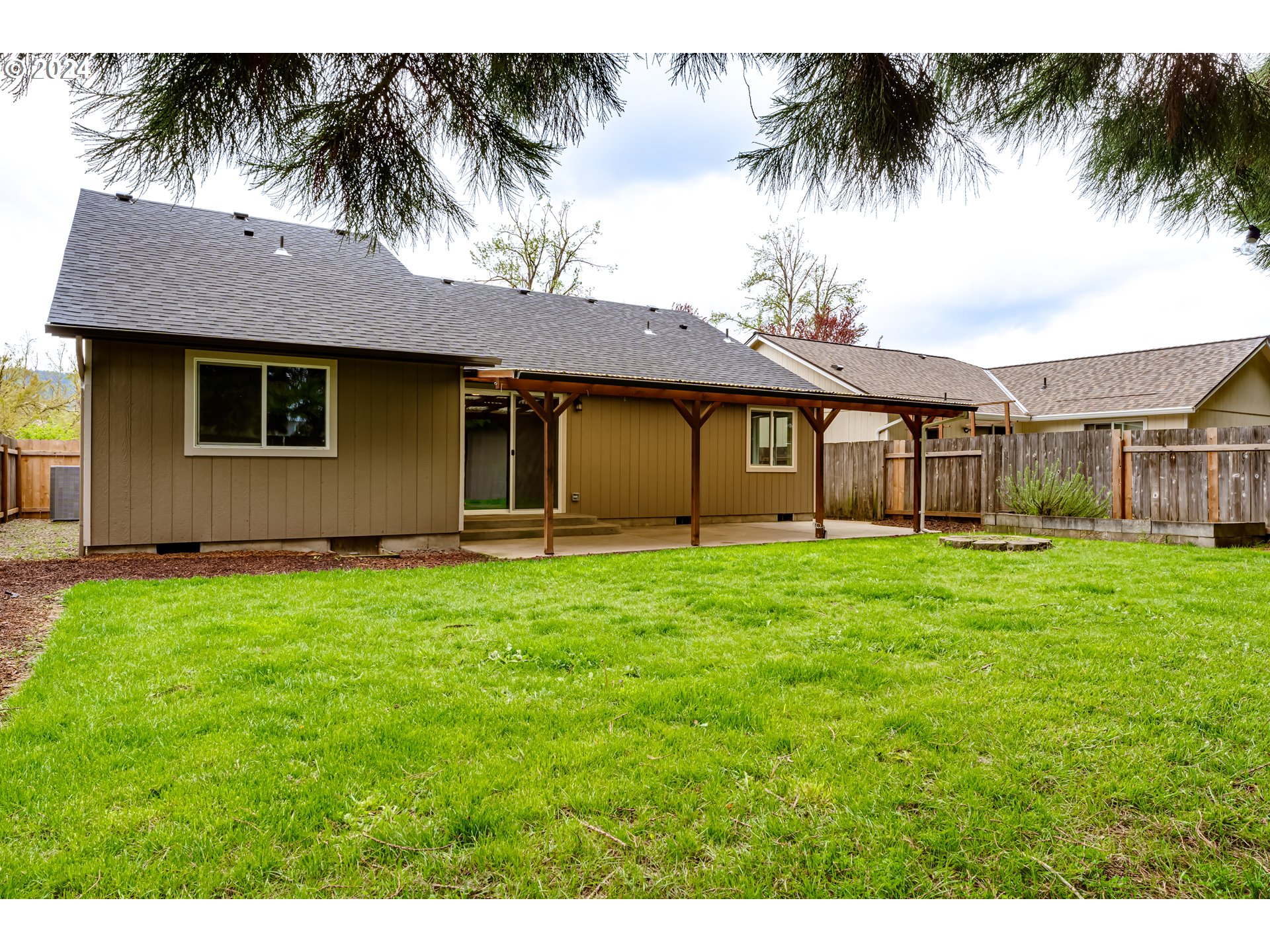 4288 Cole Way Springfield, OR 97478 - Photo 21 of 21 a view of a house with a backyard