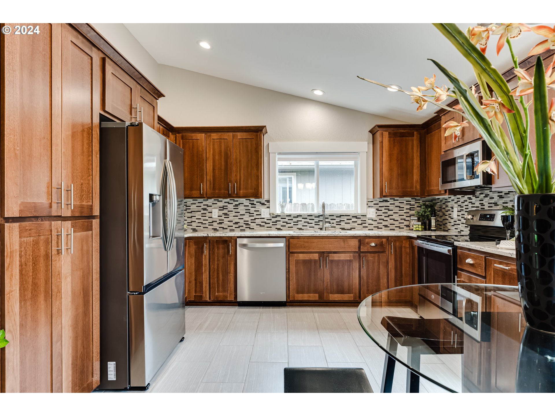 4288 Cole Way Springfield, OR 97478 - Photo 5 of 21 a kitchen with stainless steel appliances granite countertop a refrigerator and a sink