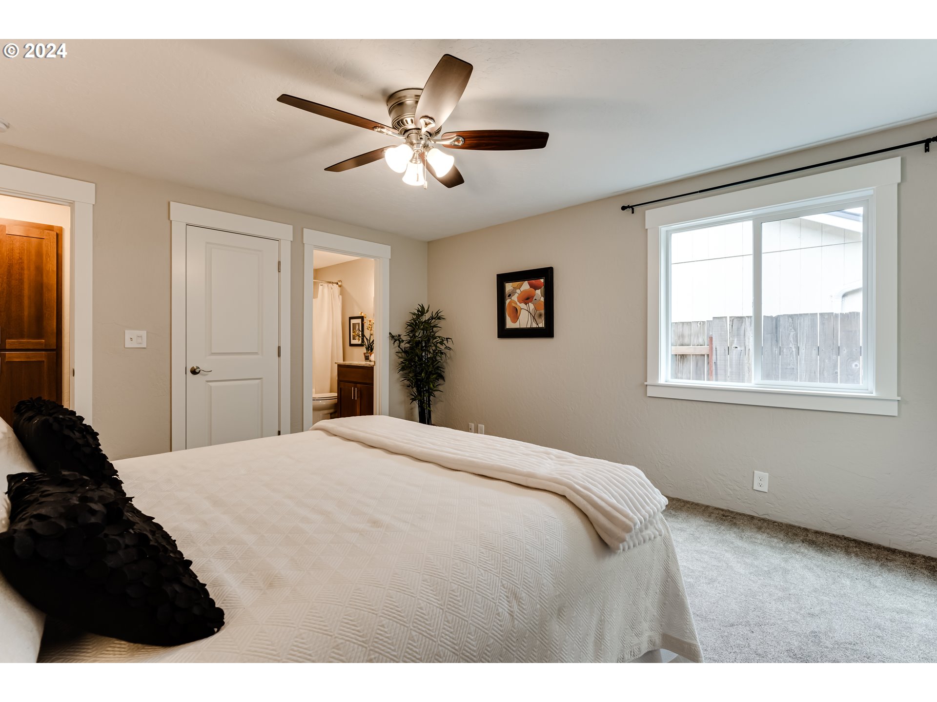 4288 Cole Way Springfield, OR 97478 - Photo 10 of 21 a bedroom with a large bed and a window