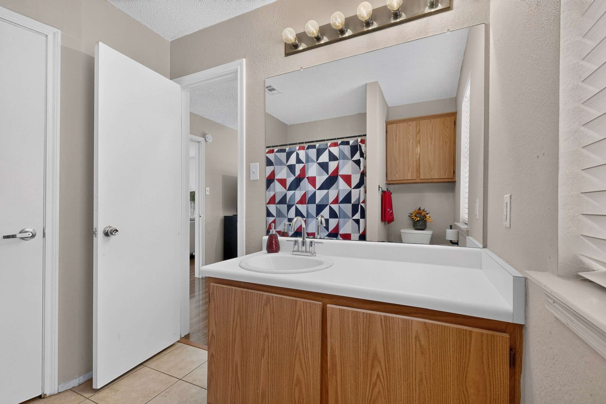 1601 Rusty Nail Loop Round Rock, TX 78681 - Photo 13 of 23 A single vanity and tiled flooring create a highly functional space.