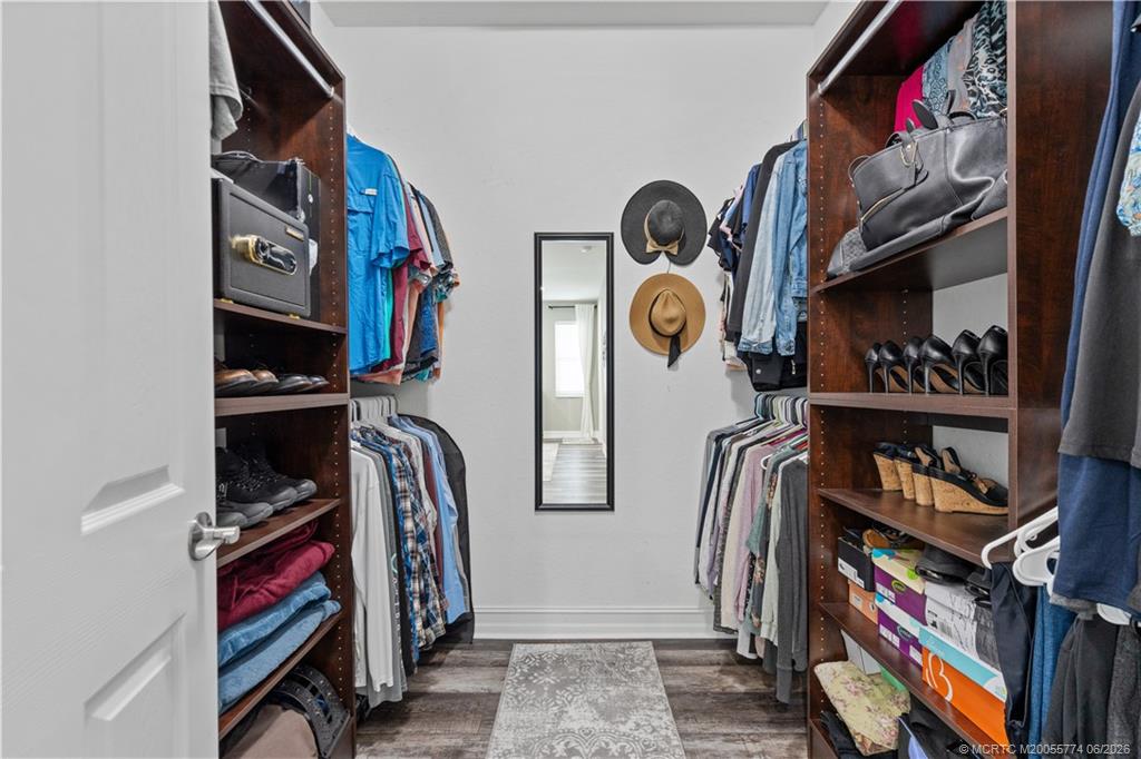 1268 Southeast Kirk Street Stuart, FL 34997 - Photo 39 of 63 a view of walk in closet with clothes and shoes