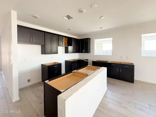 a kitchen with a sink a stove and refrigerator