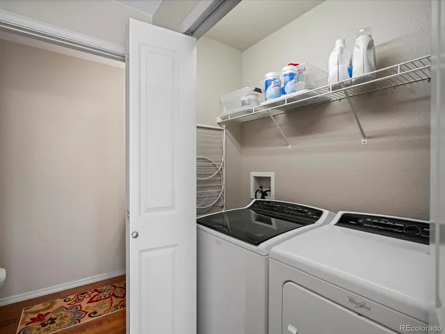 a close view of sink a stove and refrigerator