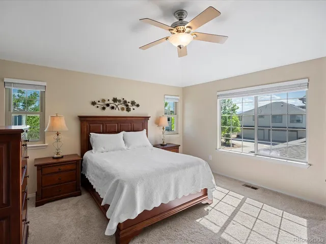 a bedroom with a large bed and a window