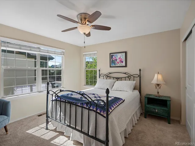 a bed room with a bed and a window