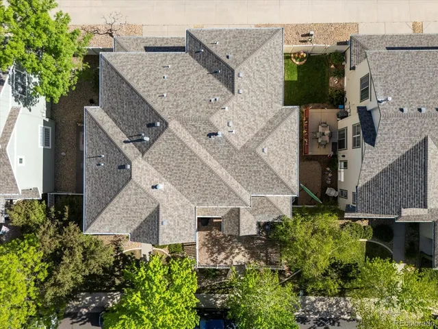 an aerial view of houses with an outdoor space