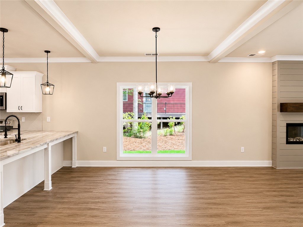 328 Point Road Westminster, SC 29693 - Photo 24 of 24 An open floorplan seamlessly connects the kitchen and living areas, offering effortless daily living.