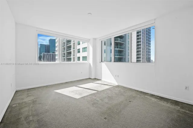 a view of an empty room with a window