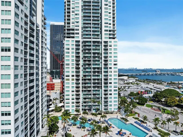 a view of lake from balcony with outdoor seating