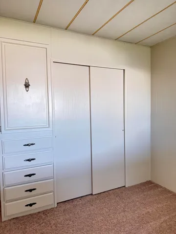an empty room with cabinet
