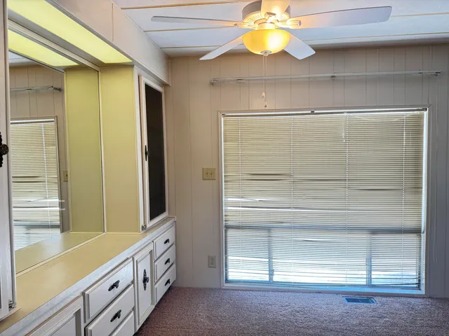 a bathroom with a double vanity sink and a window