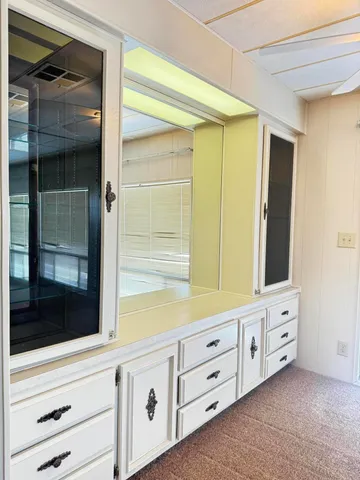 a bathroom with a sink a mirror and shower