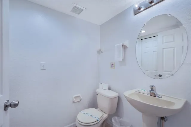 a kitchen with stainless steel appliances granite countertop a refrigerator a stove a sink dishwasher with a dining table and chair