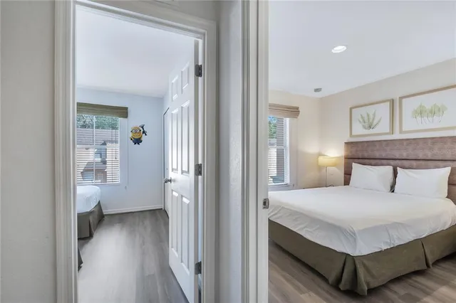 a bedroom with a bed and a night stand