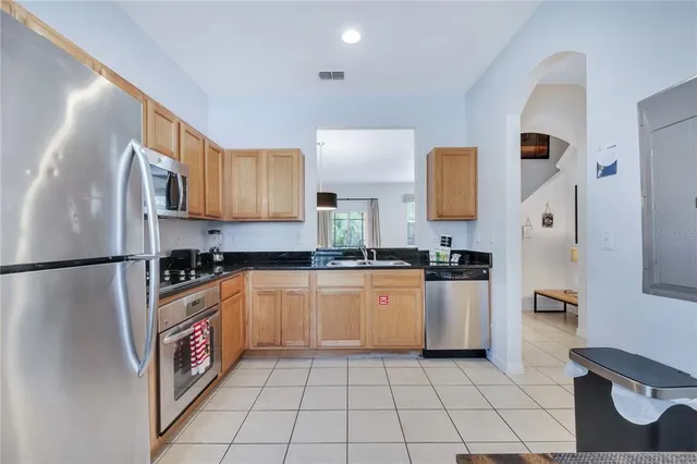 a kitchen with a sink and a stove
