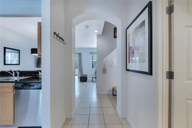 a view of a hallway with paintings on the wall