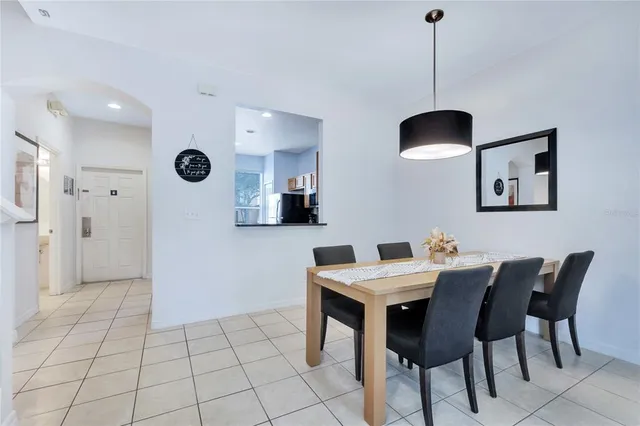 a bedroom with two beds and painting on the wall