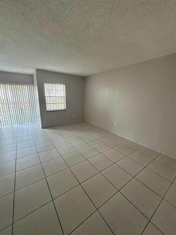 9331 Southwest 4th Street, Unit 104B Miami, FL 33174 - Photo 5 of 11 a view of an empty room and window
