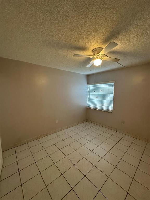 9331 Southwest 4th Street, Unit 104B Miami, FL 33174 - Photo 7 of 11 en empty room with fan