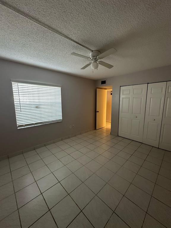 9331 Southwest 4th Street, Unit 104B Miami, FL 33174 - Photo 8 of 11 a view of an empty room and a window