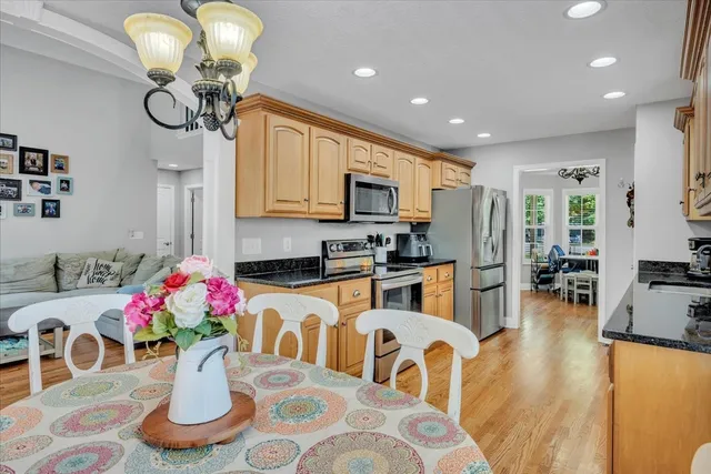 a kitchen with furniture potted plant and refrigerator