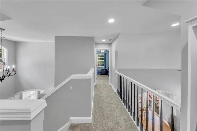 a view of a hallway with windows