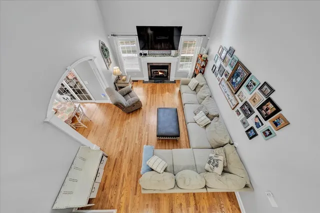 view of living room with furniture and a fireplace