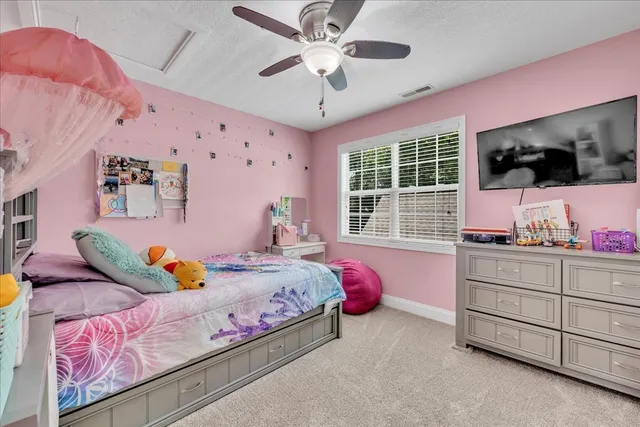 a bedroom with bed and furniture