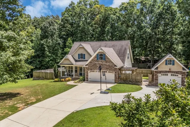 a front view of a house with garden