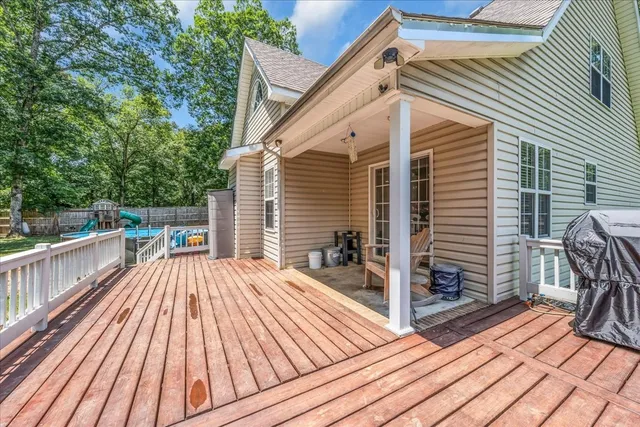 a view of balcony with deck and wooden floor