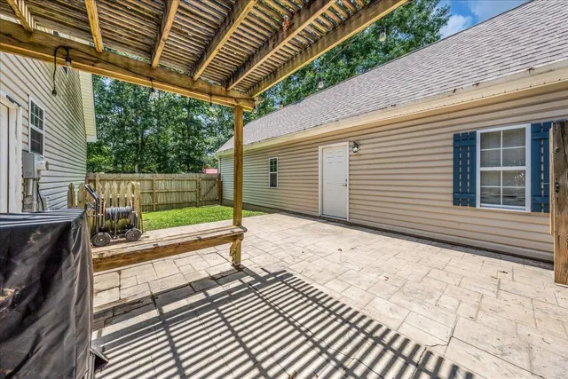 a view of a backyard with sitting area
