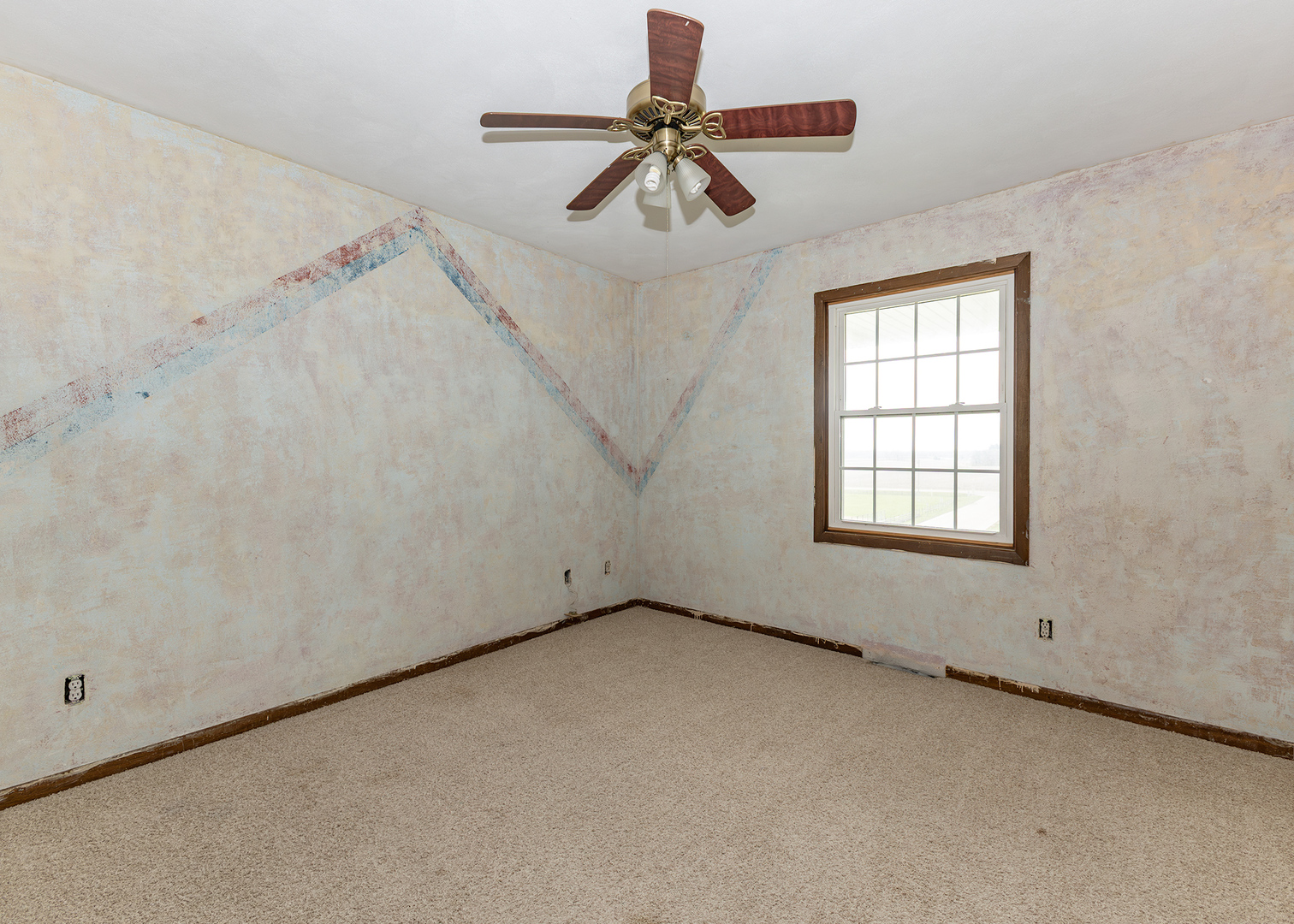 25 Oak Grove Road Geneseo, IL 61254 - Photo 14 of 22 an empty room with windows and fan