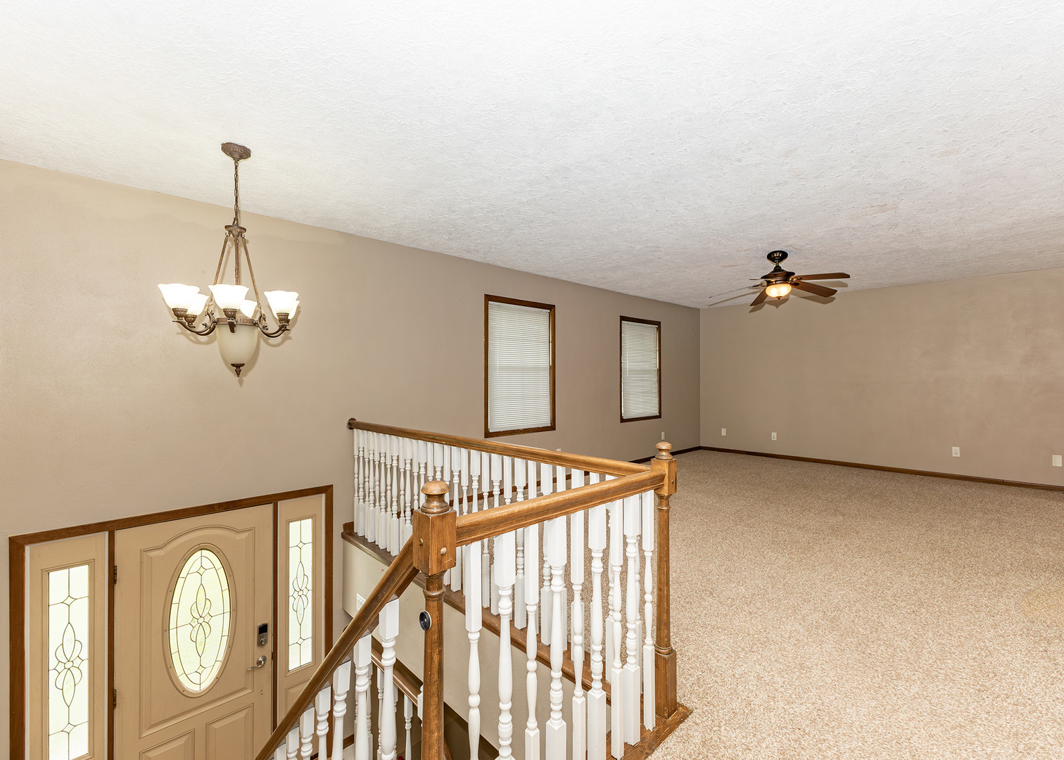 25 Oak Grove Road Geneseo, IL 61254 - Photo 8 of 22 a view of a chandelier fan and wooden floor