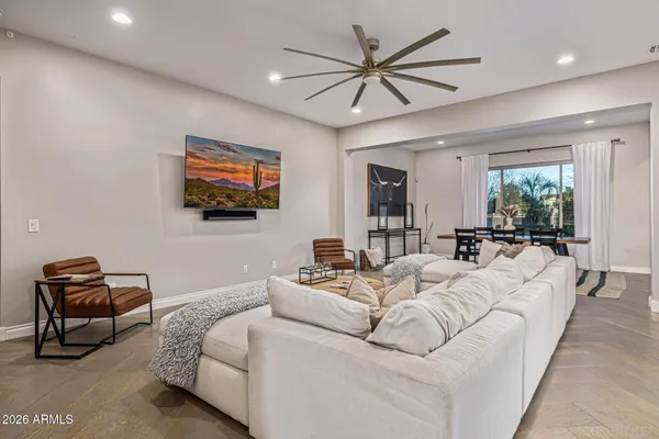 a kitchen with stainless steel appliances kitchen island granite countertop a refrigerator and a stove top oven
