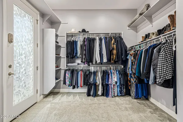 a bathroom with a double vanity sink mirror and shower